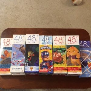 Eleven 48 piece puzzles